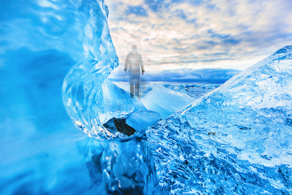 figure of a man on frozen ice in ocean, time stopped