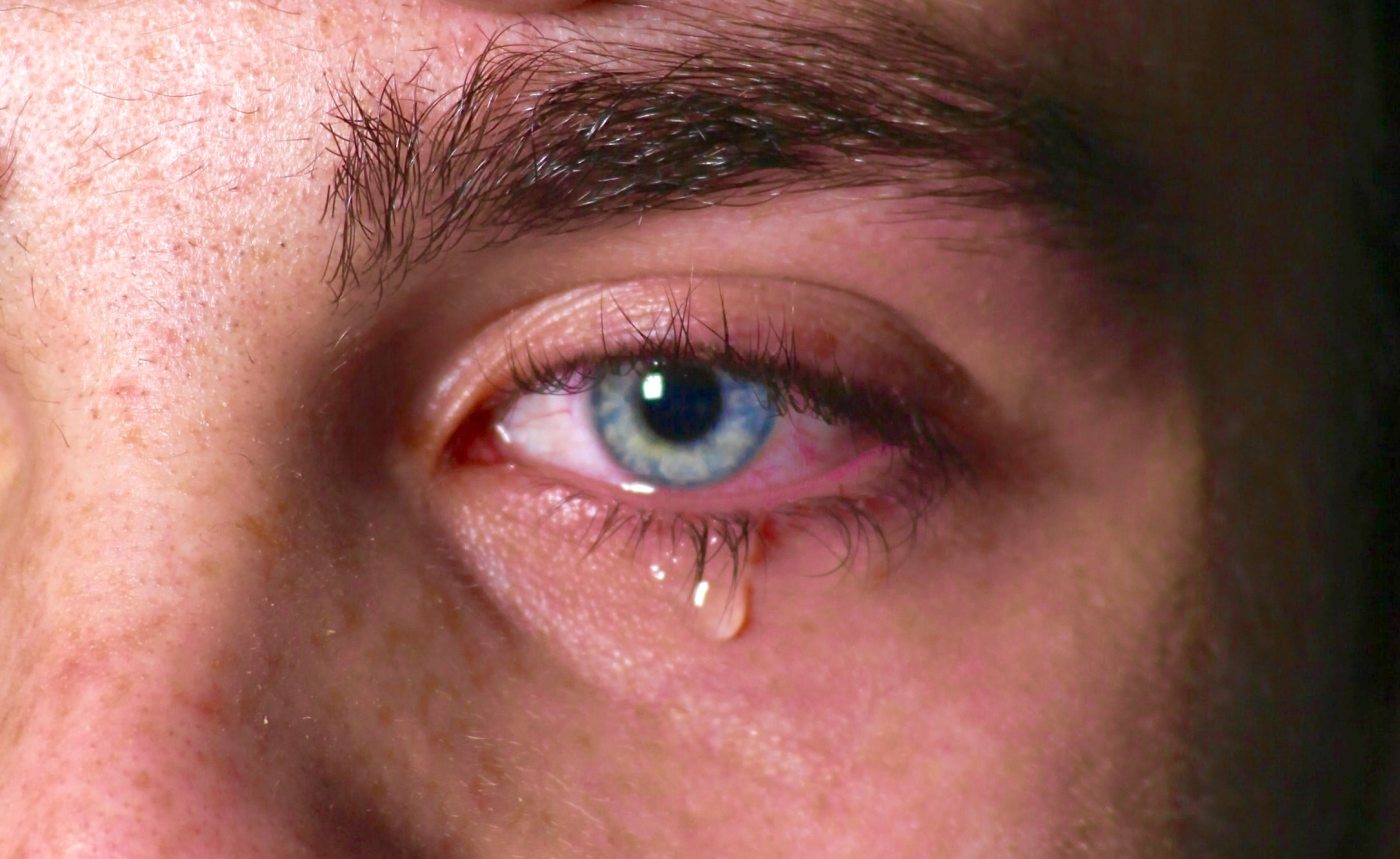 man shedding a tear